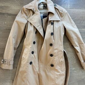 Burberry double breasted trench with removable quilted liner.